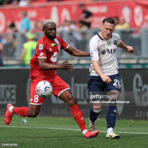 Jean-Daniel Akpa Akpro of AC Monza challenges Piotr Zielinski of SSC Napoli as he passes the ball during the Serie A TIM match between AC Monza and...