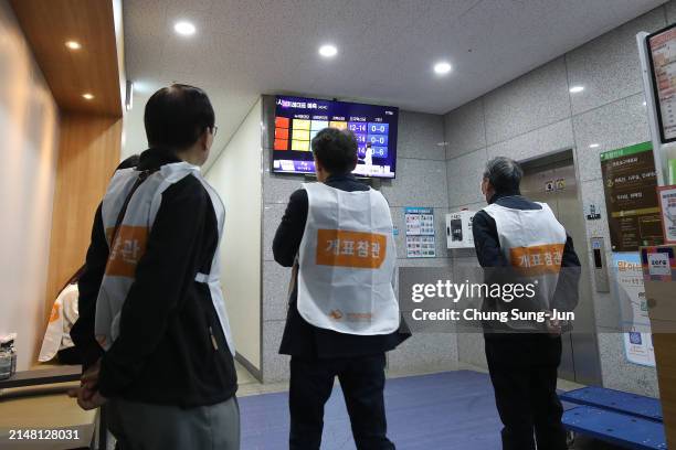 People watch for a news report on the results of parliamentary election on April 10, 2024 in Seoul, South Korea. The ruling People Power Party led by...