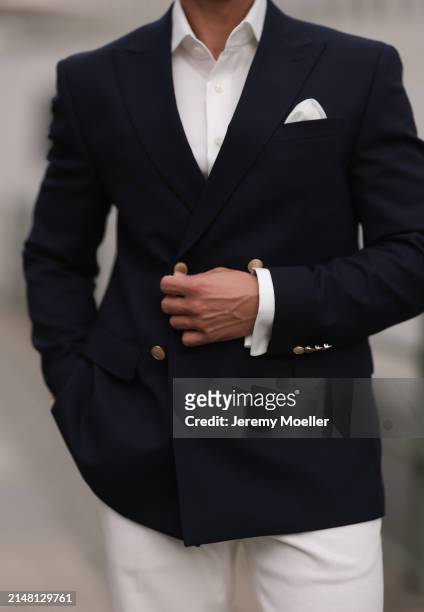 André Hellmundt seen wearing Olymp white cotton buttoned shirt, Suit Supply white suit pants, Hechter Paris navy blue elegant blazer jacket, on April...