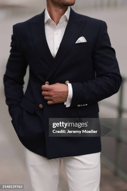 André Hellmundt seen wearing Olymp white cotton buttoned shirt, Suit Supply white suit pants, Hechter Paris navy blue elegant blazer jacket, on April...