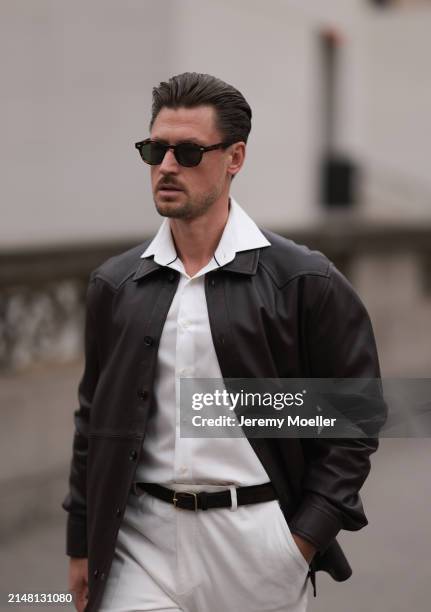 André Hellmundt seen wearing Explicit Poets brown sunglasses, Olymp white cotton buttoned shirt, J. Lindeberg brown leather jacket, black leather...