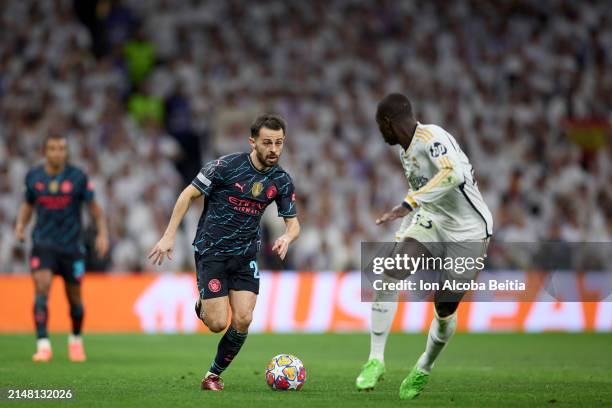 Bernardo Silva of Manchester City compete for the ball with Ferland Mendy of Real Madrid CF during the UEFA Champions League quarter-final first leg...
