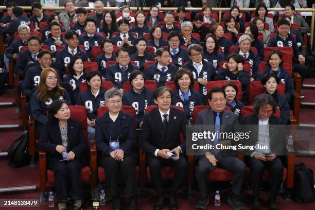 Cho Kuk leader of the South Korean Rebuilding Korea Party, and his party members wait for a news report on the results of exit polls for...