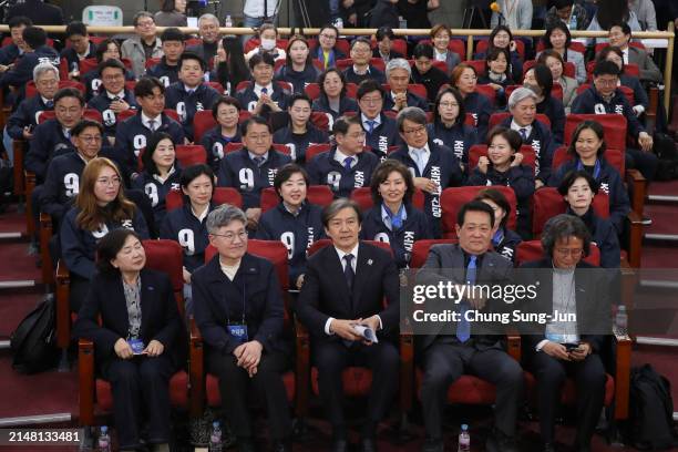 Cho Kuk leader of the South Korean Rebuilding Korea Party, and his party members wait for a news report on the results of exit polls for...