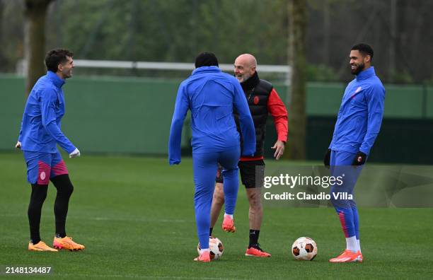 Head coach AC Milan Stefano Pioli, Christian Pulisic and Ruben Loftus-Chek of AC Milan chat during the UEFA Europa League 2023/24 quarter-final first...