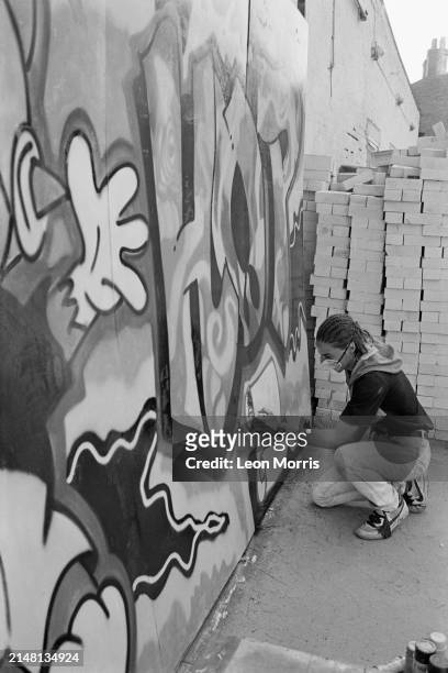 Street artist Zaki Dee, member of graffiti crew The Trailblazers , at work on an artwork done in occasion of the GLC Hip Hop Jam, a breakdance...