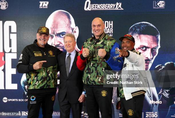 Father of Tyson Fury, John Fury, Boxing Promoter, Frank Warren, Tyson Fury, and Boxing Trainer, SugarHill Steward, pose for a photo after a press...