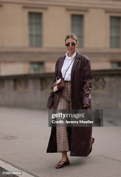 Aline Kaplan seen wearing Carolina Lemke gold sunglasses, gold earrings, Sézane white cotton ruffled button blouse / shirt, Sézane beige / brown...