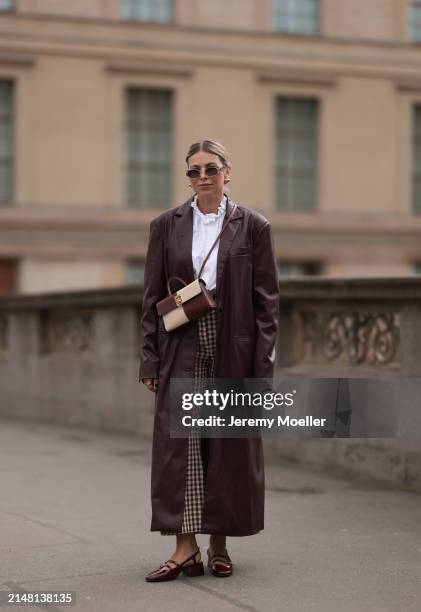 Aline Kaplan seen wearing Carolina Lemke gold sunglasses, gold earrings, Sézane white cotton ruffled button blouse / shirt, Sézane beige / brown...