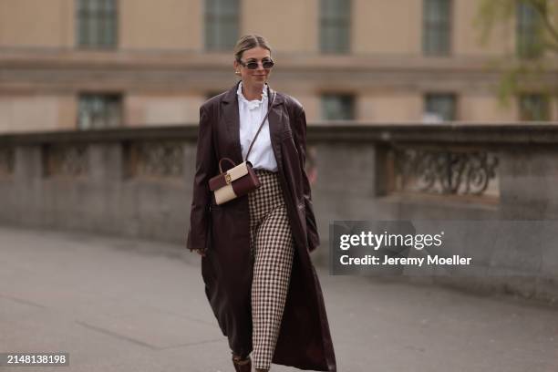 Aline Kaplan seen wearing Carolina Lemke gold sunglasses, gold earrings, Sézane white cotton ruffled button blouse / shirt, Sézane beige / brown...