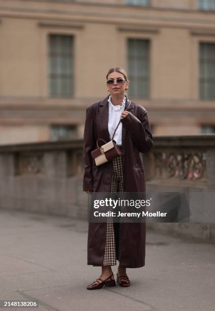 Aline Kaplan seen wearing Carolina Lemke gold sunglasses, gold earrings, Sézane white cotton ruffled button blouse / shirt, Sézane beige / brown...