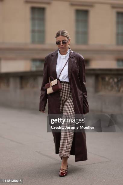Aline Kaplan seen wearing Carolina Lemke gold sunglasses, gold earrings, Sézane white cotton ruffled button blouse / shirt, Sézane beige / brown...