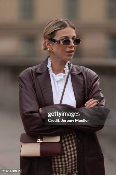 Aline Kaplan seen wearing Carolina Lemke gold sunglasses, gold earrings, Sézane white cotton ruffled button blouse / shirt, Sézane beige / brown...