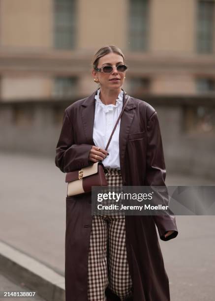 Aline Kaplan seen wearing Carolina Lemke gold sunglasses, gold earrings, Sézane white cotton ruffled button blouse / shirt, Sézane beige / brown...