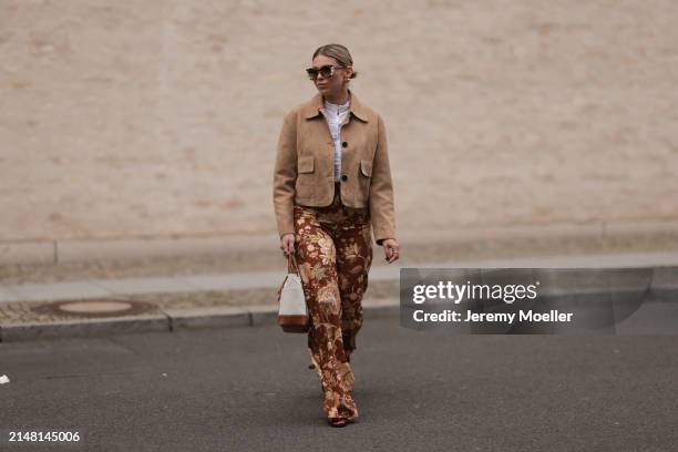 Aline Kaplan seen wearing Tibi brown sunglasses, gold earrings, Massimo Dutti beige / brown suede leather short jacket, Mango white cotton blouse,...