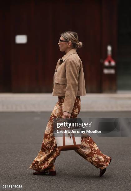 Aline Kaplan seen wearing Tibi brown sunglasses, gold earrings, Massimo Dutti beige / brown suede leather short jacket, Mango white cotton blouse,...