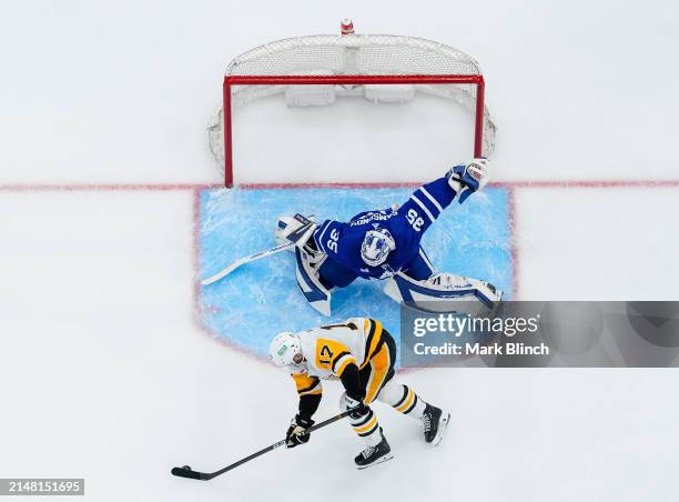 Ilya Samsonov of the Toronto Maple Leafs makes a save against Bryan Rust of the Pittsburgh Penguins during the second period at Scotiabank Arena on...