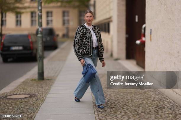 Aline Kaplan seen wearing gold heart shaped earrings, Sézane black / white flower embroidered jacket, Mango white cotton blouse, Citizen Of Humanity...