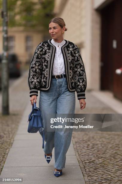 Aline Kaplan seen wearing gold heart shaped earrings, Sézane black / white flower embroidered jacket, Mango white cotton blouse, Citizen Of Humanity...