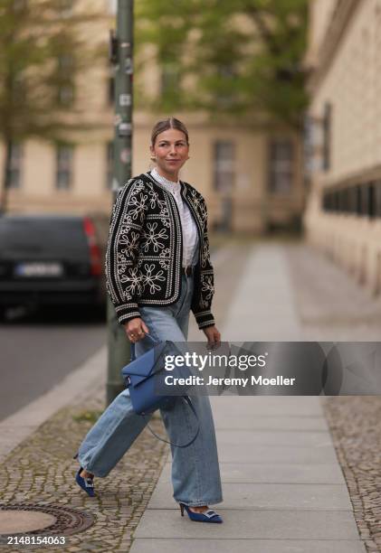 Aline Kaplan seen wearing gold heart shaped earrings, Sézane black / white flower embroidered jacket, Mango white cotton blouse, Citizen Of Humanity...