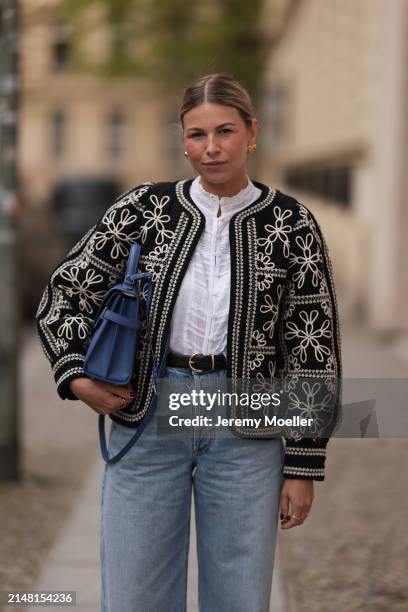 Aline Kaplan seen wearing gold heart shaped earrings, Sézane black / white flower embroidered jacket, Mango white cotton blouse, Citizen Of Humanity...