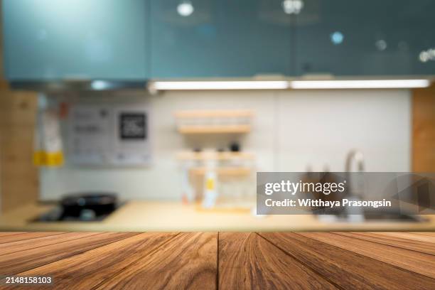 wood table top on blur kitchen wall room background - backgrounds stock pictures, royalty-free photos & images