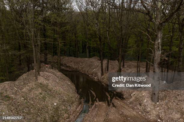 Illegally dumped commercial waste covers a cleared area in Hoads Wood on April 09, 2024 in Ashford, Kent. Hoads wood in Kent is a 199 acre site of...