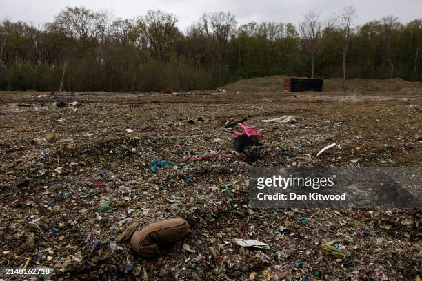 Illegally dumped commercial waste covers a cleared area in Hoads Wood on April 09, 2024 in Ashford, Kent. Hoads wood in Kent is a 199 acre site of...
