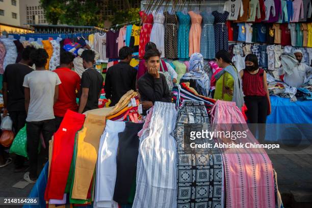 Man sells clothes on the street ahead of Eid al-Fitr on April 10, 2024 in Bengaluru, India. Muslims worldwide observe the Eid Al-Fitr prayer to mark...