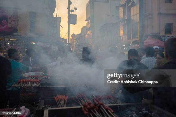 Muslim man prepares seekh kebabs on skewers on a street ahead of Eid al-Fitr on April 10, 2024 in Bengaluru, India. Muslims worldwide observe the Eid...