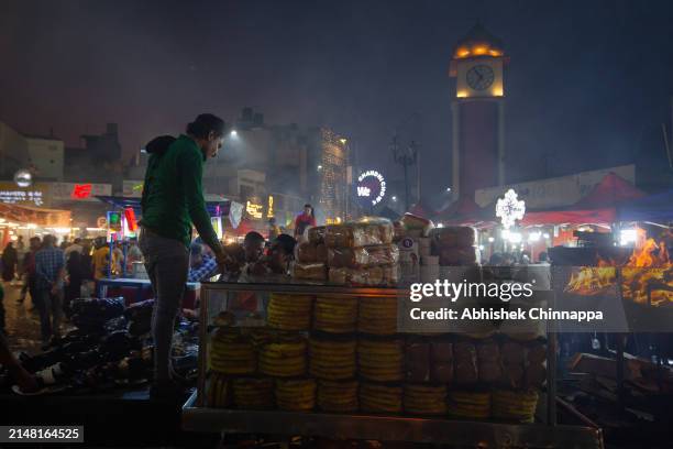 Muslim man prepares seekh kebabs on skewers on a street ahead of Eid al-Fitr on April 10, 2024 in Bengaluru, India. Muslims worldwide observe the Eid...