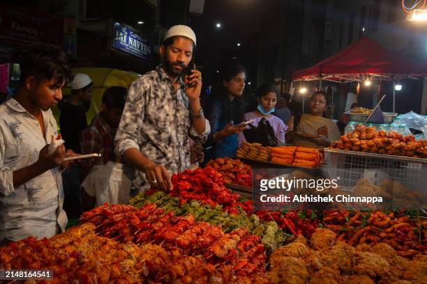 Muslim man sells different kinds of kebabs on a street ahead of Eid al-Fitr on April 10, 2024 in Bengaluru, India. Muslims worldwide observe the Eid...