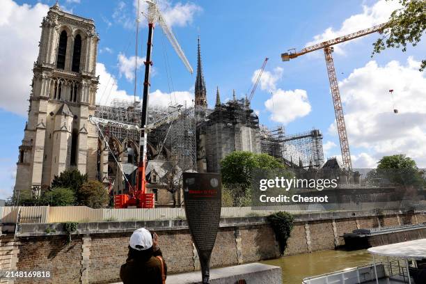 Notre-Dame de Paris Cathedral and its new spire are seen almost five years after fire ravaged the emblematic monument on April 10, 2024 in Paris,...