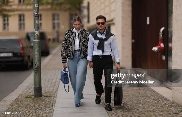 Aline Kaplan seen wearing gold heart shaped earrings, Sézane black / white flower embroidered jacket, Mango white cotton blouse, Citizen Of Humanity...