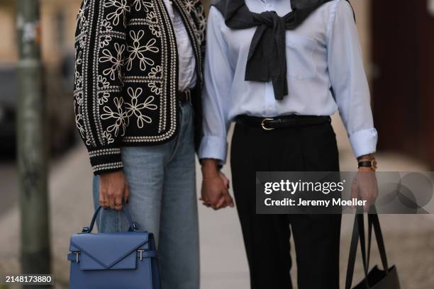 Aline Kaplan seen wearing Sézane black / white flower embroidered jacket, Mango white cotton blouse, Citizen Of Humanity blue denim wide leg jeans,...