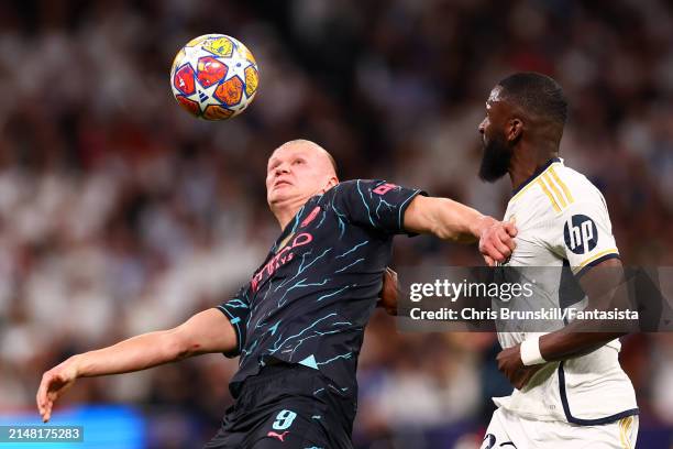 Antonio Rudiger of Real Madrid in action with Erling Haaland of Manchester City during the UEFA Champions League quarter-final first leg match...