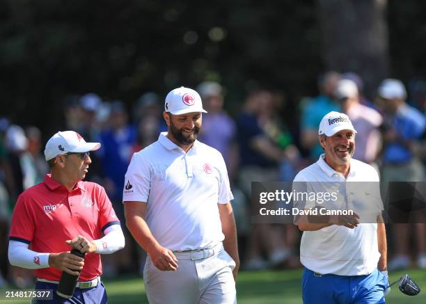 Jon Rahm of Spain, Sergio Garcia of Spain and Jose Maria Olazabal of Spain walks off the second tee during a practice round prior to the 2024 Masters...