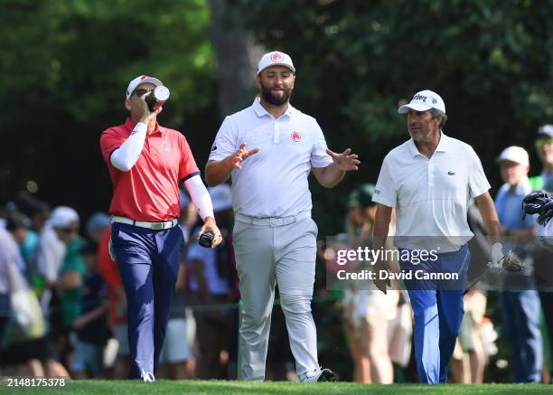 Jon Rahm of Spain, Sergio Garcia of Spain and Jose Maria Olazabal of Spain walks off the second tee during a practice round prior to the 2024 Masters...