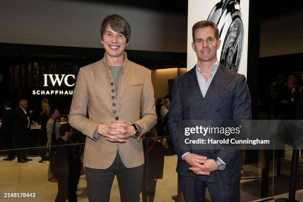 Professor Brian Cox and IWC Schaffhausen CEO Chris Grainger-Herr at the IWC Schaffhausen booth at Watches and Wonders Geneva on April 10, 2024 in...