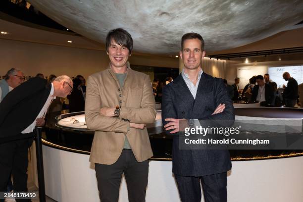 Professor Brian Cox and IWC Schaffhausen CEO Chris Grainger-Herr at the IWC Schaffhausen booth at Watches and Wonders Geneva on April 10, 2024 in...