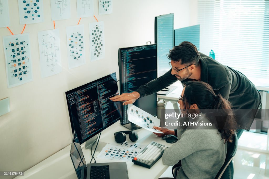 Hispanic Programmers Collaborating on Software Development in a Modern Office Setting
