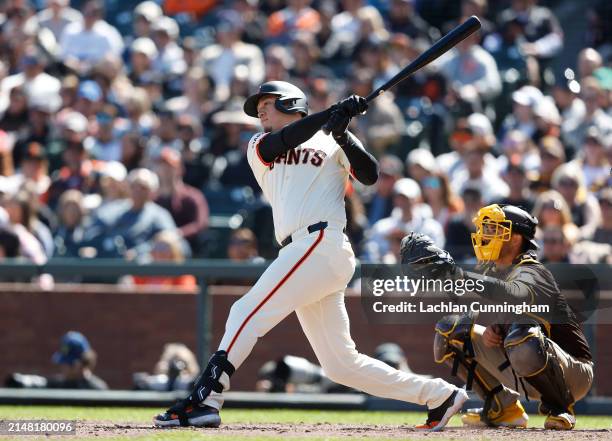 Wilmer Flores of the San Francisco Giants hits a single in the bottom of the eighth inning against the San Diego Padres at Oracle Park on April 07,...