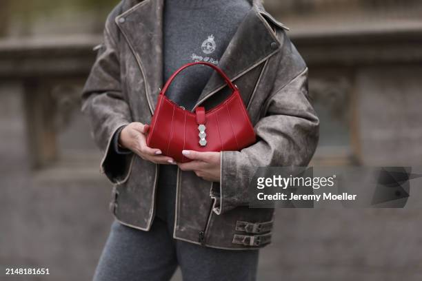 Sonia Lyson seen wearing Sporty & Rich grey cashmere sweater, matching Sporty & Rich grey cashmere grey jogging pants, Ducie London grey oversized...
