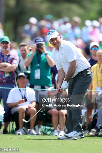 Nick Faldo of England plays his shot from the second tee during the Par Three Contest prior to the 2024 Masters Tournament at Augusta National Golf...