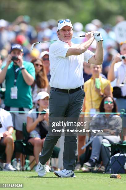 Nick Faldo of England plays his shot from the second tee during the Par Three Contest prior to the 2024 Masters Tournament at Augusta National Golf...