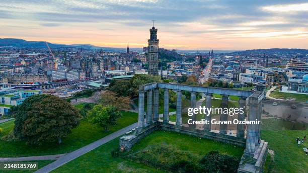 aerial view of calton hill, edinburgh sunset aerial view, gothic revival architecture in scotland, view of edinburgh city center from calton hill - old national centre stock pictures, royalty-free photos & images