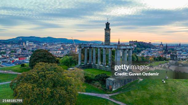 aerial view of calton hill, edinburgh sunset aerial view, gothic revival architecture in scotland, view of edinburgh city center from calton hill - old national centre stock pictures, royalty-free photos & images