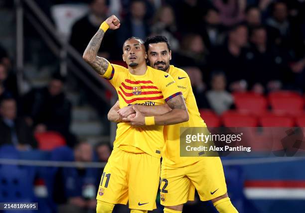 Raphinha of FC Barcelona celebrates scoring his team's first goal with teammate Ilkay Guendogan during the UEFA Champions League quarter-final first...