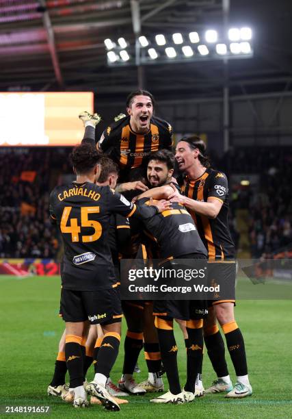 Jean Michael Seri of Hull City celebrates scoring his team's second goal with Abduelkadir Omuer and teammates during the Sky Bet Championship match...