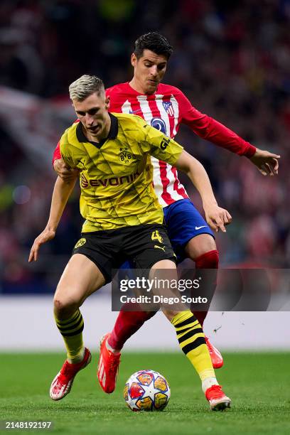 Alvaro Morata of Atletico Madrid battles for the ball with Nico Schlotterbeck of Borussia Dortmund during the UEFA Champions League quarter-final...